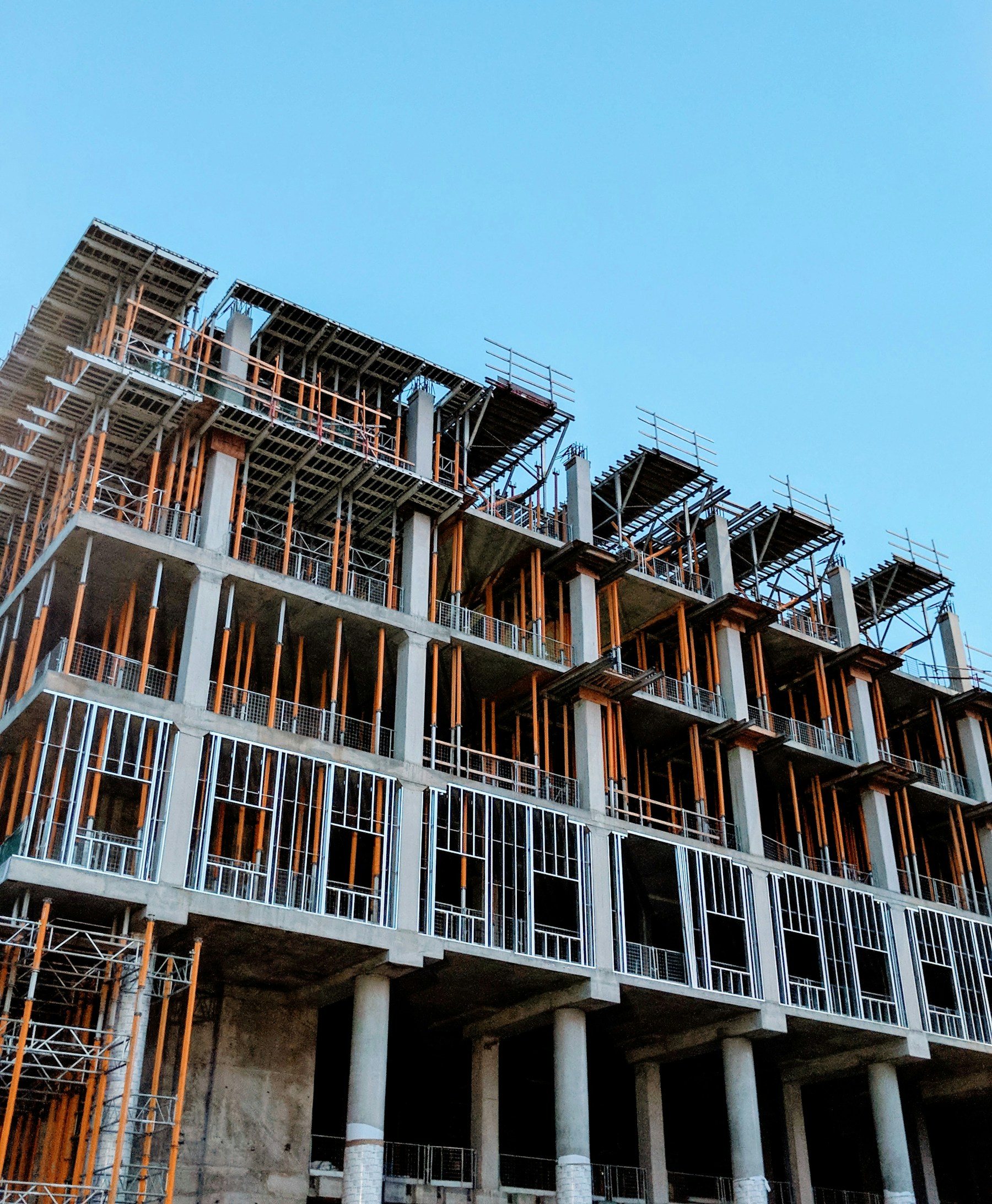 Residential tower under construction with exposed concrete structure